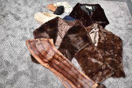 An assortment of vintage gloves and mittens and scarves including fur stoles,one being mink.