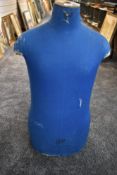 A vintage French male mannequin torso in blue 'Cleo 77 Changis sur Marne' printed to front.