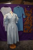 A mixture of vintage dresses,including unusual pale blue dirndl dress.