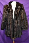 A mid length vintage dark brown mink coat having Continental furs,Blackpool label.