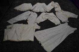 A collection of victorian white cotton items including two pairs of Victorian bloomers, crisp cotton