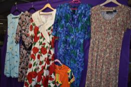 Six brightly patterned vintage 1980s dresses, mixed styles and sizes.