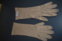 A pair of vintage beige Christian Dior sea island gloves.