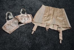 A pale pink CC41 girdle and bra,bra still having original price attached,smaller sizes.