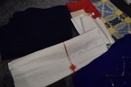 A mixed lot of vintage fabrics, perfect for crafts and projects.