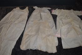 A collection of early 20th century babies clothing.