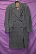 A vintage 1940s CC41 gents double breasted coat in blue checked wool having half belt to vented