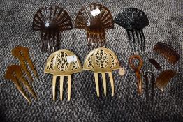 A variety of art deco hair combs and slides.