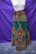 A bright vintage wrap around skirt from Burma and similar styled tunic