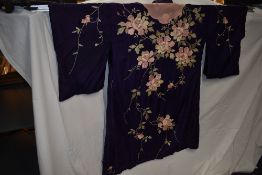 A purple silk kimono dressing gown having extensive floral embroidery,around 1920s-40s,a couple of