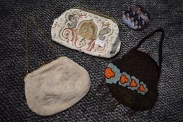 Three extensively beaded antique bags and a coin purse.