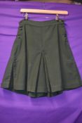 A pair of bottle green 1940s culottes/shorts, pleats to sides and button fastening to each.