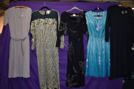 A selection of vintage 1970s and 80s maxi dresses and sun dresses.