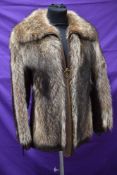 A ladies vintage fox fur jacket having leather panels to sides and sleeves,pockets to sides and