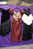 Four 1980s statement evening dresses amongst which is a full length black acetate dress with red