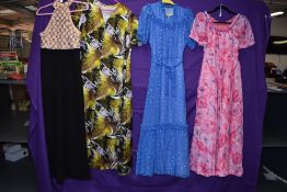 Three vibrant 1970s maxi dresses in various sizes also included is a jump suit.