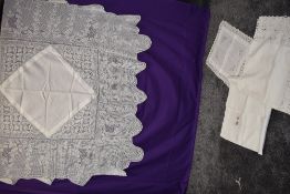 A small collection of vintage table linen including table cloth with deep crotchet to edge.