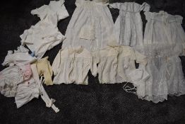 A varied lot of childrens/babies clothing, some knitted, others cotton with delicate detailing,