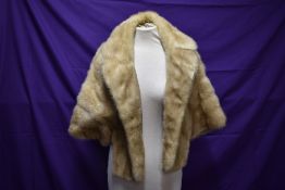 A blonde mink shrug with sleeves/jacket having F.M.R monogram to lining.