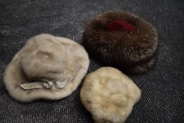 Three vintage 1960s hats, two mink and one fox fur.