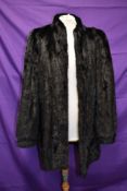 A mid length vintage black mink coat.