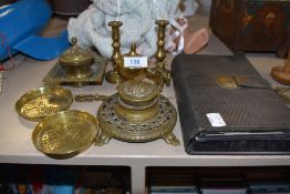 A selection of desktop items including brass cast ink well and leather bound carry case