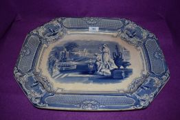 A large Blue and white platter having transfer pattern of classical scene to centre, marked A shaw