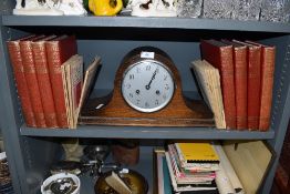 An oak cased mantle clock of Napoleon design and Book of knowledge and printing text books