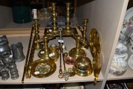 A selection of fine antique and later brass fire side items including 2 candle stick pairs fire dogs