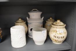 A collection of ceramics including kitchen jars and more.