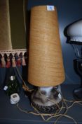 A vintage studio pottery table lamp with conical shade.