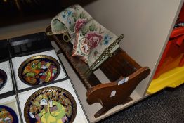 An oak book trough and embroidered throw