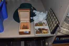 A collection of vintage costume jewellery, a box, a hat and a pair of vintage gloves and bag.