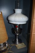 A 'famos' incandescent oil lamp with original instruction manual.