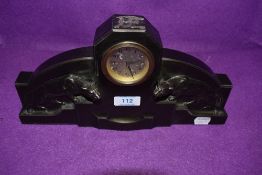 An art deco bronzed mantel clock having silver dial of stepped design with wild cats / Jaguars to