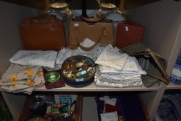 A selection of haberdashery items including handbags and table cloths