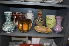 A selection of planters and vases, various styles and eras.
