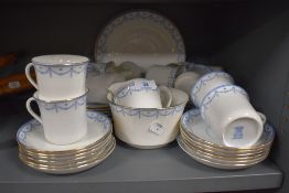 A part tea service having blue transfer print and gilt edging by S&NL Elite