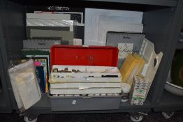 An array of art supplies including cases, pads of paper,palette and more.