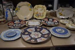 A selection of ceramic display plates including two Japanese Imari plates and Copeland Spode stand
