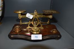 A set of antique postal or letter scales with assortment of weights