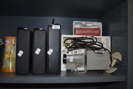 A Hanimette projector, screen and a selection of cases.