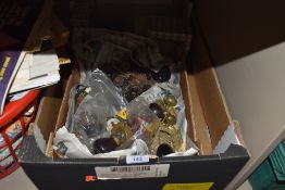 A box of varied door knobs including glass and some boxes of screws.