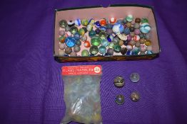 A small selection of mixed vintage glass and clay marbles including three having colourful twist