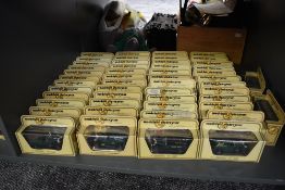 A collection of 50 Matchbox Models of Yesteryear diecast vehicles all in yellow window boxes