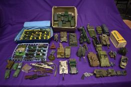 A shelf of Dinky, Corgi, Britains and similar playworn diecast military vehicles and accessories