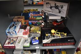 A shelf of modern toys including John Lewis Desktop Train Set, Marks & Spencer RC Mini Cooper S