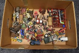 A box of Britains, Corgi and similar playworn diecast farm vehicles and machinery, wild west,