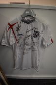 A 2005-2007 England Football Shirt, size mens small, bearing approx 10 signatures including Wayne