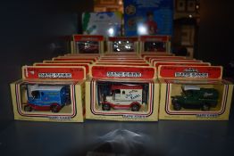 A collection of 34 Lledo Days Gone diecasts, all in original yellow and red window boxes